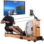 Skandika Rudergerät Wasser aus Holz Lykke | Wasser Rudergerät für Zuhause, 45% mehr Widerstand mit 90° Tank, aus massiver europäischer Buche, Kinomap App kompatibel, Wasserrudergerät platzsparend